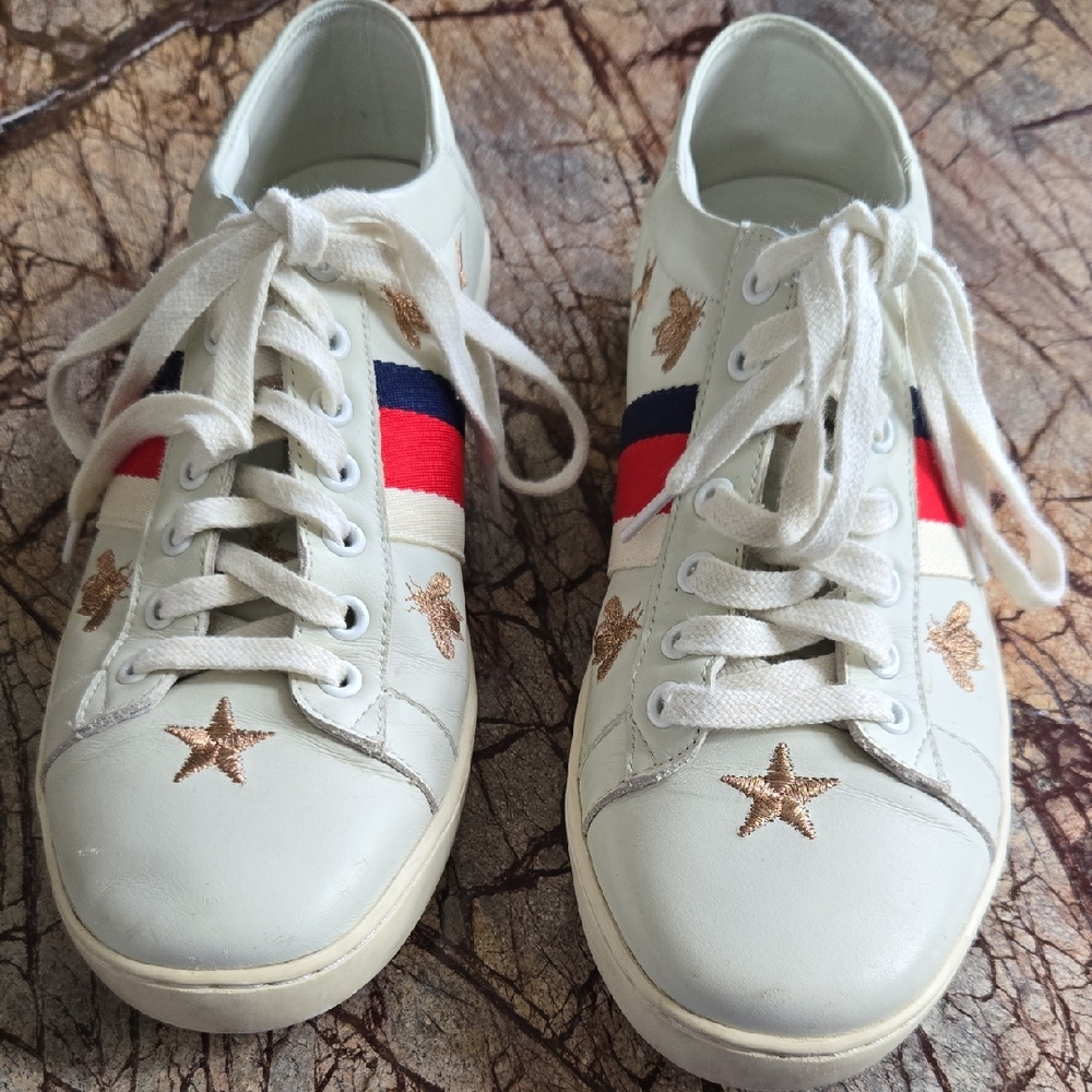 Vintage White Athletic Shoes with Red and Blue Accents